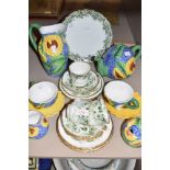 A part breakfast set having moulded sunflower design if blue ground including cups and saucers,
