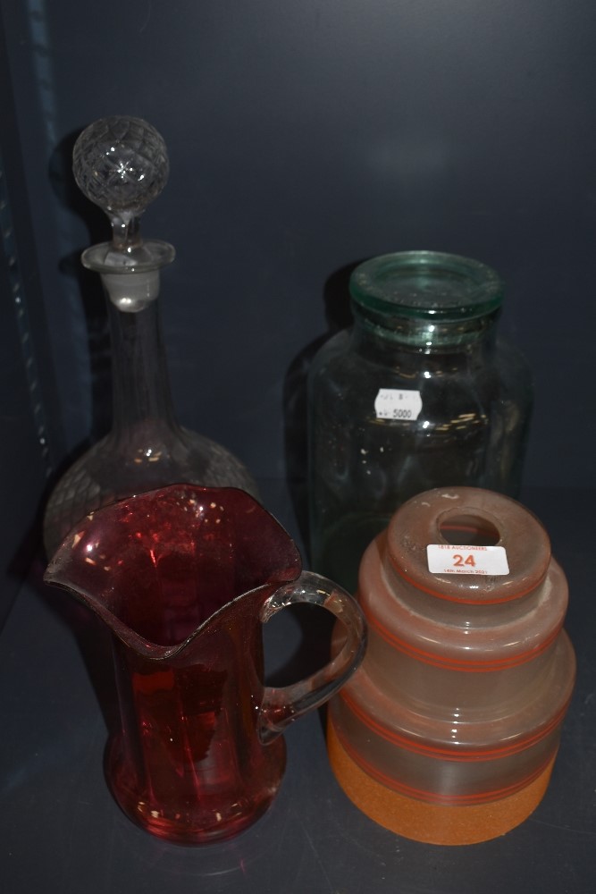 A selection of glass wares including Dewsbury glass jar, Orange art deco shade and decanter