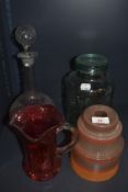 A selection of glass wares including Dewsbury glass jar, Orange art deco shade and decanter