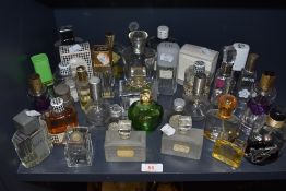 A selection of vintage and modern perfumes and aftershaves including fancy bottles and Miss Dior