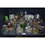 A selection of vintage and modern perfumes and aftershaves including fancy bottles and Miss Dior