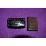 A Victorian papier mache white metal inlayed snuff box and similar pressed vesta case