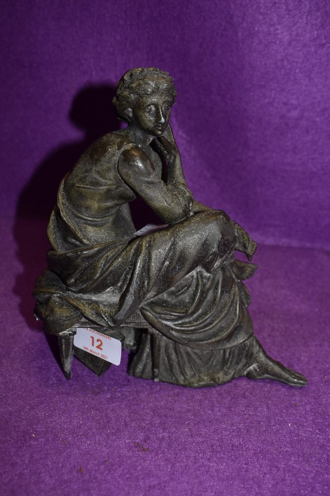 A French spelter cast figure base of a woman in thought