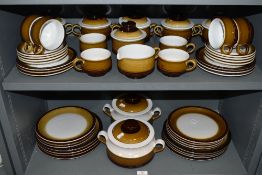 A large part dinner and tea service by Denby in a brown and cream colour way