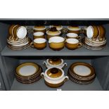 A large part dinner and tea service by Denby in a brown and cream colour way