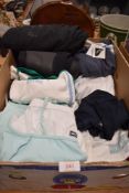 A box of clothing including Reebok sportswear and an Oneil wetsuit.