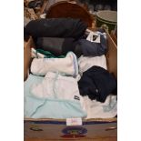 A box of clothing including Reebok sportswear and an Oneil wetsuit.