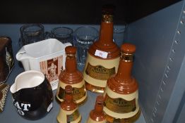 A selection of ceramic Whiskey decanters and similar tavern items