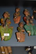 Four hand carved wooden figures hand painted with Middle Eastern influence