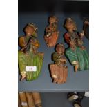 Four hand carved wooden figures hand painted with Middle Eastern influence