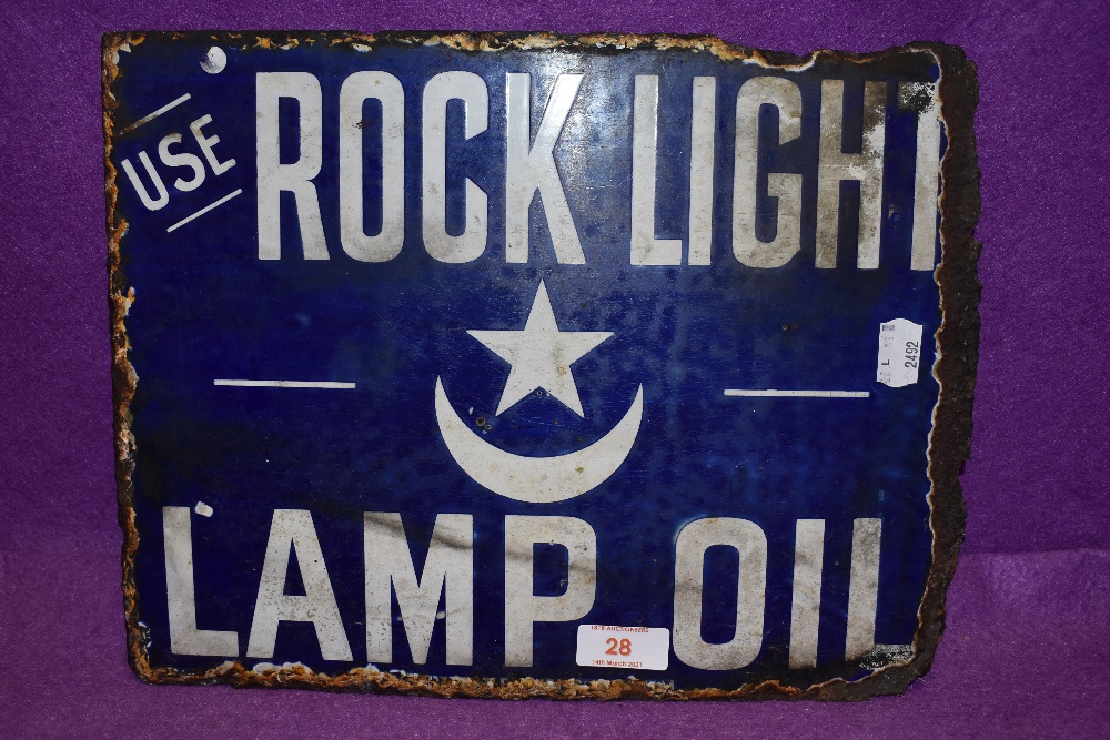 A partial enamel double sided advertising sign for Rock Light Lamp Oil