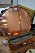 A scalloped edged serving tray in copper and similar copper and ceramic handle fish steamer