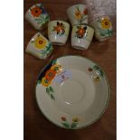 A selection of Clarice Cliff style ceramics hand painted with flowers including siz egg cups and one