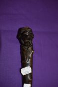 An antique walking stick hand carved in a hard wood with Monk head Character style handle in the