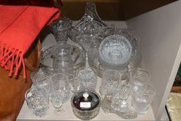 A selection of clear cut and crystal glass wares including tumblers and fruit bowls