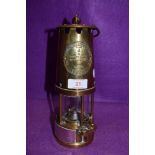 A brass presentation miners lamp by protector lamp and lighting No. 6 Eccles