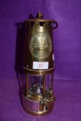 A brass presentation miners lamp by protector lamp and lighting No. 6 Eccles