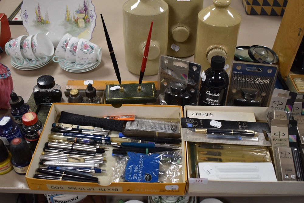 A good selection of desk top items including stationary and ink fountain and ball point pens