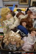 A box full of collectable dolls.
