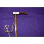 A hickory shafted riding crop having had brass banded repair