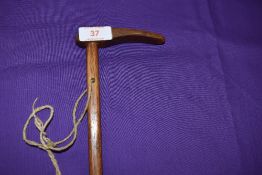 A hickory shafted riding crop having had brass banded repair