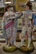 A pair of substantial continental period dressed porcelain figures of renaissance dancers possibly