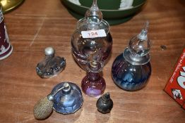 A selection of scent and perfume bottles including Eirian Welsh art glass