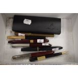 A selection of desk top fountain and similar ball point pens including Parker