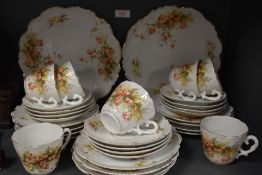 A part tea service having scalloped edge work and transfer printed design