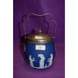 A jasper ware biscuit barrel by Wedgwood having Grecian scene