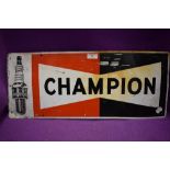 A tin printed garage sign for Champion spark plugs