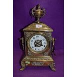 A heavy set continental brass bracket clock having enamel dial chime and extensive ormolu