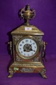 A heavy set continental brass bracket clock having enamel dial chime and extensive ormolu