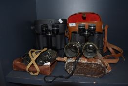 A selection of binoculars including Skybolt 7 x 50 and Pathescope 10 x 50