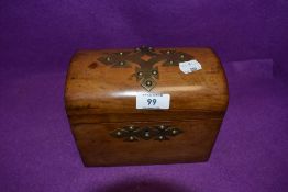 An antique treasure chest design tea caddy having tiger stripped case with brass detailing