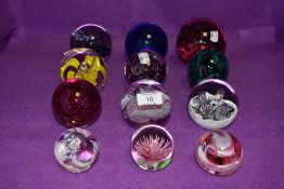 A selection of glass paper weights including Caithness Sirocco and Langham