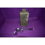 A vintage chromed GAT gun and similar cowboy styled flask