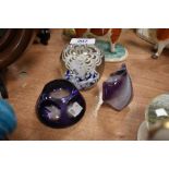 Three art glass paper weights in purple and blue hues