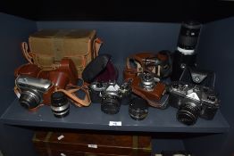 A selection of cameras and lens including Carl Zeiss Jena Pentax Werra matic Minolta AF zoom 70-210