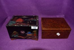 A musical Japan lacquer jewellery case and similar burr wood humidor