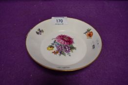 A hard paste porcelain pin dish hand decorated with flowers bearing the Meissen crossed swords