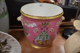 An antique hard paste highly decorated champagne or wine cooler in pink ground with floral