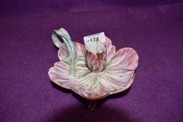 An antique chamber stick in the form of a lotus style flower hard paste body bearing Meissen crossed