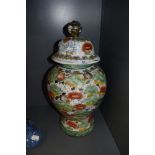 A Chinese styled porcelain lidded urn having painted decoration