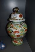 A Chinese styled porcelain lidded urn having painted decoration