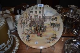 A large Royal Doulton charger from the series ware collection carriage scenes