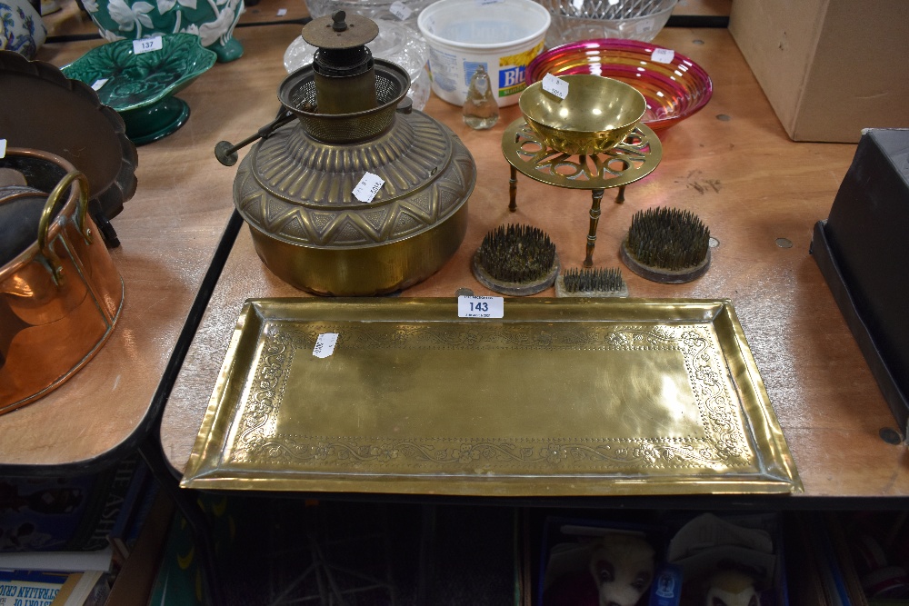 A selection of brass wares including arts and crafts styled tray and trivet etc