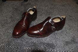 A pair of mens tailored shoes by Samuel Windsor size 9 1/2 appear unworn