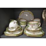 A part tea service by Bradleys in the Panel design with gilt and green colour way