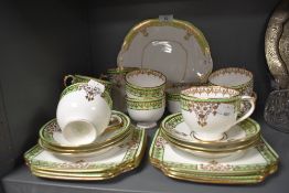 A part tea service by Bradleys in the Panel design with gilt and green colour way